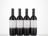 three bottles of wine sitting on top of a table next to each other