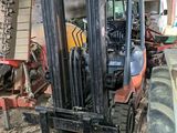 a forklift that is parked inside of a building