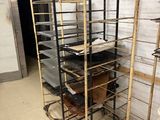 a metal rack that has a bunch of trays on top of it