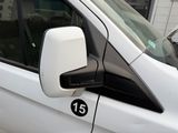 a white van parked on the side of the street