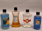 three bottles of alcohol are lined up on a white surface