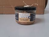 a jar of food sitting on a table next to a cardboard box