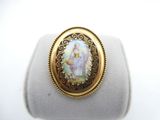 a close up of a ring with a picture of a woman on it