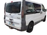 a white van that is parked on the side of the road