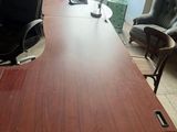a desk with a chair and a chair in a room
