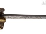 an image of a sword with a plaque on it