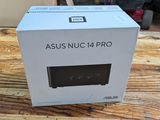 the box of the asus nuc 14 pro is sitting on a table