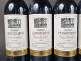 three bottles of wine are lined up on a table