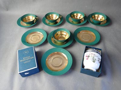 a box of tea cups and saucers and a box of salt and pepper shakers