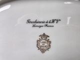 a close up of a plate with a coat of arms on it