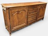 an old wooden sideboard with drawers and drawers on it