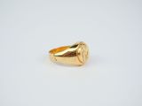 an image of a gold ring on a white background