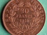 a close up of a coin on a green surface