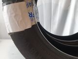 a close up of a tire with a piece of tape on it