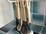 spoons and spoon hooks on a rack in the kitchen
