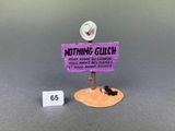 a small sign that says nothing gulch on it