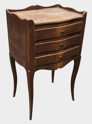 an image of a wooden table with drawers on it
