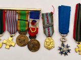 several medals and medals are displayed on a white surface