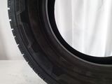 a close up of a tire on a white surface