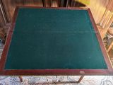 a small table with a green cloth on top of it
