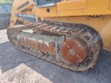 a yellow bulldozer that is sitting on the ground