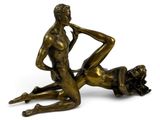 an image of a bronze statue of a man and a woman