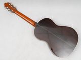 an image of a close up of a guitar on a white surface