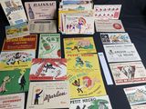 many different types of advertising cards laid out on a table