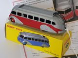 a toy bus that is sitting on top of a box