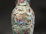 a vase that has a picture of people on it