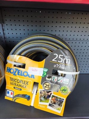 two hoses that are sitting on a shelf in a store