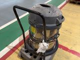 a machine that is sitting on the floor in a warehouse