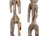 pair of wooden figures of a man and a woman