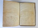 an open book on a white table with a white background
