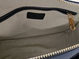 a close up of a purse with a zipper on it