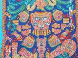 une photo d'une écharpe bleue et orange ornée d'un motif