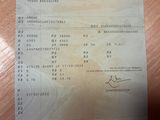 a receipt on a table with a picture of a plane