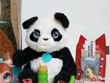 a stuffed panda bear sitting next to a stuffed bear