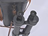 two binoculars sitting next to each other on a white surface