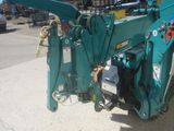 a blue machine that is parked on the side of the road