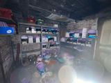 a room that has a lot of boxes and containers on the shelves