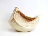a small bowl that is sitting on a white surface