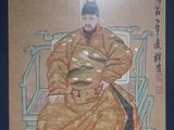 painting of a man sitting on a throne with a cat in his lap