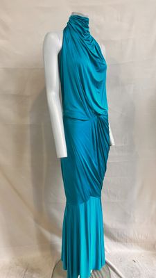 a woman ' s turquoise dress on a mannequin mannequin mannequin mannequin mannequin mannequin mannequin mannequin