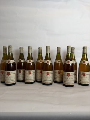 several bottles of wine are lined up on a table
