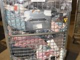 a metal cart with many items in it in a warehouse