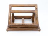 an old wooden magazine rack on a white surface with a white background