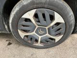 a close up of a tire on the side of a car