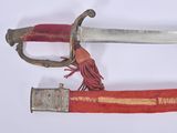 two swords that are on display on a white surface