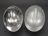 a silver hard hat and a silver hard hat on a black surface
